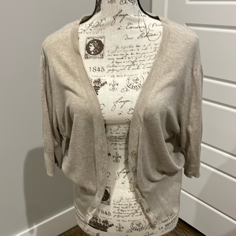 Ambiance plus size 2X light tan cardigan. Deep V 6 button with elbow sleeve.